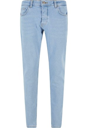 Svijetloplave uske traperice s pet džepova, prednjim zatvaračem na dugme i dekorativnim šavovima. Glatka tekstura i prilagođen oblik.