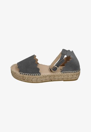Gray suede espadrille sandal with scalloped edges, ankle strap, and woven jute sole. Flat design, neutral tones, and textured finish.