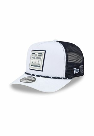 Weiß-schwarze New York Yankees Snapback-Kappe mit Netzrücken und "Spring Training Tampa, Florida" Aufnäher auf der Frontseite.