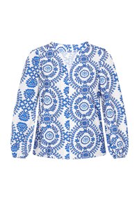 Blusa bianca con motivi floreali blu e cerchi, maniche lunghe e polsini elastici, con chiusura frontale a bottoni.