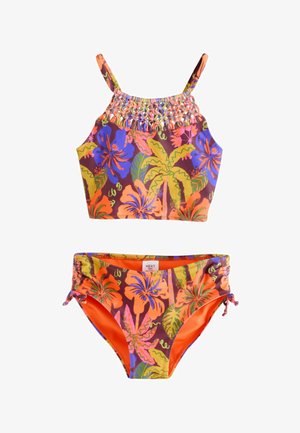 Kaksiosainen bikinit yläosalla ja samankaltaisilla alaosilla. Elävä kukkakuvio, jossa oranssin, violetin ja vihreän sävyjä. Topissa on smokkauksen yksityiskohta.