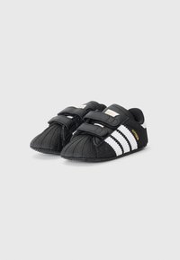 adidas Originals SUPERSTAR CRIB UNISEX - Πρώτα παπούτσια - black/white/gold-coloured