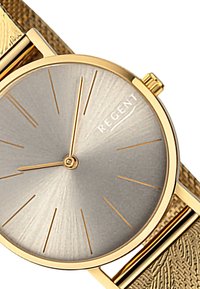 Montre dorée avec un bracelet en or texturé, un cadran argenté en rayon de soleil, des index horaires dorés et le nom de la marque "REGENT" à la position 1 heure.