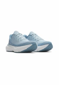 Light blue athletic shoes with a textured knit upper, white midsole, and a patterned rubber outsole. Features traditional lacing system.