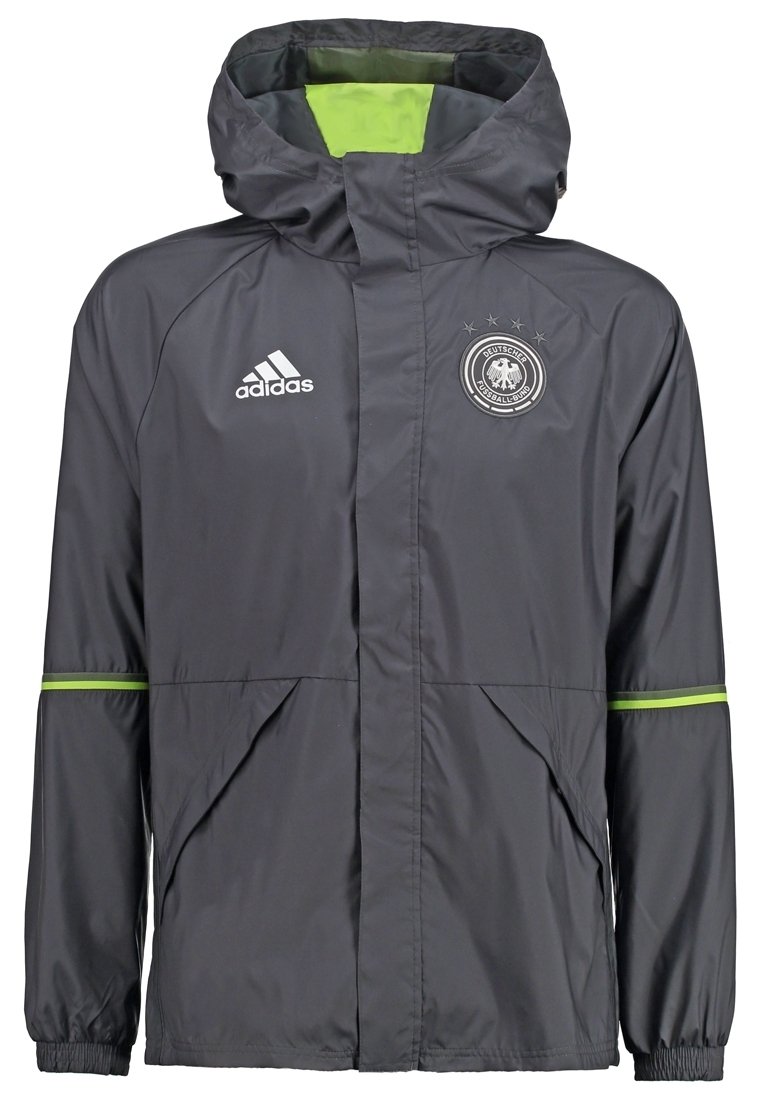 Giacca a vento Adidas grigia con fodera verde, dotata di zip frontale, cappuccio regolabile e logo con emblema sul petto.