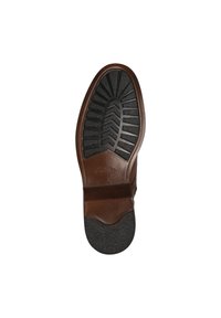 Semelle en cuir marron avec un crampon en caoutchouc noir texturé, présentant des rainures définies et une légère courbure à l'orteil pour une meilleure adhérence.