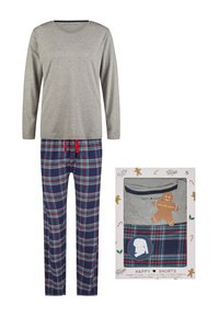Grijze lange mouw top gecombineerd met marineblauwe geruite pyjamabroek met groene en rode accenten. Set verpakt in een feestelijk thema kartonnen doos.