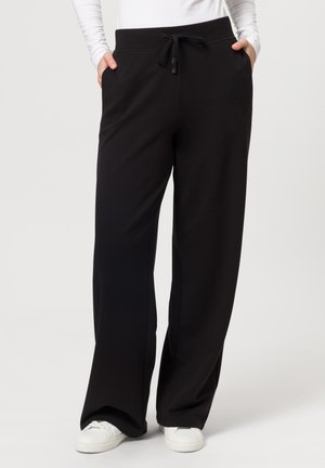 Zwarte, lichtgewicht joggingbroek met een relaxed fit, voorzien van een elastische tailleband met trekkoord, zijzakken en een soepele textuur.