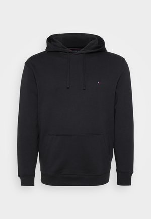 Black hoodie in soft fabric with a front pocket, adjustable drawstring, and a small logo detail on the chest. Standard fit with ribbed cuffs.