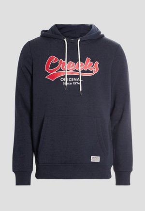 Navy blue hoodie made of cotton with a front kangaroo pocket, drawstring hood, and red "Creeks Original Since 1974" graphic.
