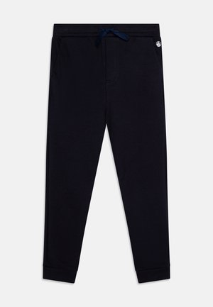 Navy blue jogger pants made of soft fabric, featuring a drawstring waistband, side pockets, and tapered cuffs.