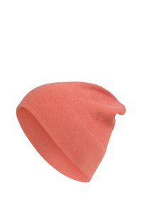 Cotton beanie in coral pink, soft texture, slouchy design with a snug fit at the base, featuring a simple, unembellished finish.