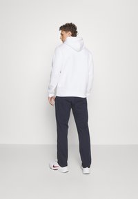 Champion CLASSIC STRAIGHT HEM PANTS - Treningo apatinė dalis - dark blue