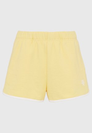 Shorts en coton jaunes avec une taille élastique, un biais blanc le long de l'ourlet et un petit logo brodé sur le devant.