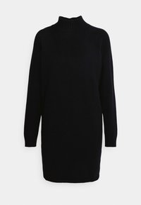 Robe noire en maille avec un col montant, des manches longues et une coupe légèrement ample. Présente des poignets et un ourlet côtelés pour la texture.