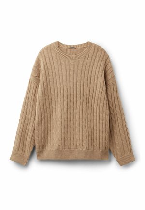 Sweter z dzianiny w kolorze beżowym o prążkowanej fakturze i wzorze warkoczowym. Posiada okrągły dekolt oraz długie rękawy w luźnym kroju.