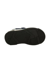 Semelle de chaussure avec une surface en caoutchouc noir présentant un motif texturé et des designs géométriques pour une meilleure adhérence et durabilité.
