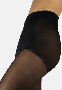 Pantys negros transparentes con una textura suave, diseño de cintura alta y una costura que corre verticalmente en la parte posterior para un detalle adicional.