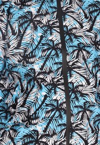 Korte mouw shirt met een blauw en zwart palmbladpatroon; heeft een zwarte ritssluiting en een gladde, textuurstof.
