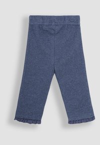 Ribbed navy blue leggings with a fitted design, an elastic waistband, and ruffled hem detailing at the ankle. Soft texture, stretchy material.