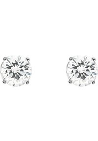 Round diamond stud earrings in a four-prong setting, featuring clear, faceted stones with a polished metal backing.