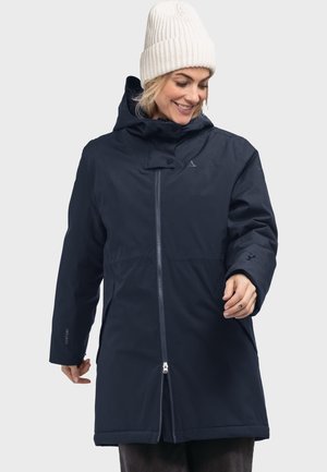 Navy waterproof parka with a hood, front zipper, and two side pockets. Features a smooth texture and a branded accent on the sleeve.