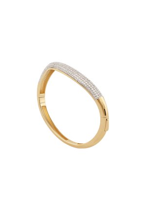 Gold-toned bangle with a curved design and a surface embellished with clear gemstones, featuring smooth edges and a subtle shine.