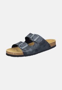 Black slide sandals with two adjustable straps, a cork footbed, textured rubber sole, and printed pattern on the straps.