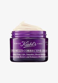 Lila Glasbehälter mit einer weißen Creme darin, beschriftet mit "Super Multi-Corrective Cream", mit silberner Schrift und einem Schraubdeckel.