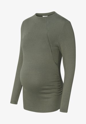 Langarm, olijfgroen zwangerschapsblouse gemaakt van zachte, rekbare stof. Voorzien van zijdelingse ruching voor een goede pasvorm en een ronde halslijn.