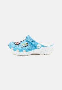 Blue plastic clog featuring cartoon character designs, textured upper, and a white sole with a logo on the side. Adjustable strap included.