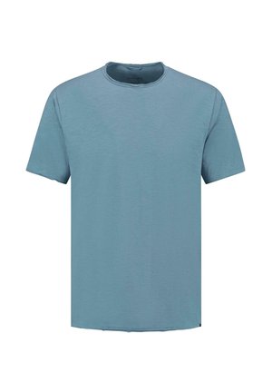 Jasnoniebieska koszulka z krótkim rękawem o okrągłym dekolcie i luźnym kroju. Miękka struktura z subtelną, nieco nierówną powierzchnią.