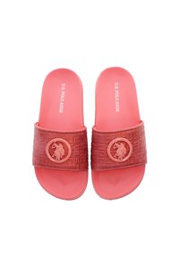 Różowe klapki na slip-on z teksturowaną taśmą z okrągłym logo. Wykonane z gumy, mają gładką wkładkę i otwarty nosek.