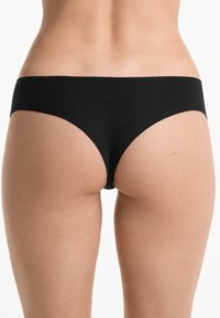 Zwarte bikini onderkant met een naadloos ontwerp, gemiddelde bedekking en een gladde textuur, met strakke lijnen en zonder zichtbare hardware.