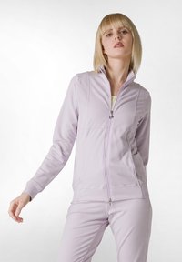 Ljuslila zip-up sweatshirt i mjukt material, med hög krage, sidofickor och ribbstickade ärmar. Slät tygtextur.