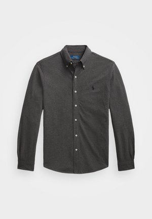 Dark gray button-up shirt with long sleeves, featuring a point collar, subtle texture, and a small logo on the chest.
