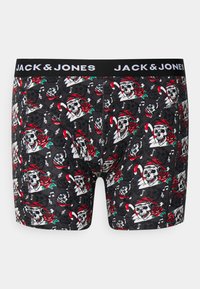 Boxer breif neri con un motivo di teschi e rose, dotati di un cappello di Babbo Natale rosso, bastoncini di zucchero e note musicali. Vita elastica con branding.