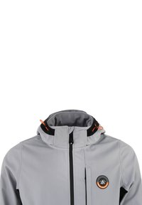 Grå vattentät jacka med svarta accenter, hög krage och framdragkedja. Har en orange dragsko och en cirkulär logotyp på bröstet.