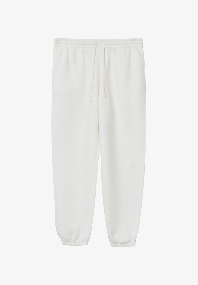 Pantalons de jogging blancs en tissu doux avec une taille élastique et un cordon de serrage. Présente des poignets côtelés aux chevilles.
