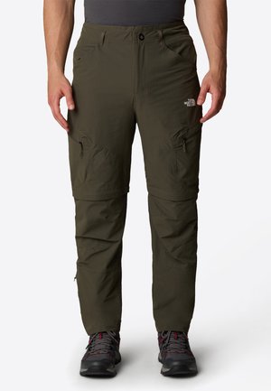 Green outdoor pants made of lightweight fabric, featuring zippered pockets, a comfortable waistband, and tapered legs.