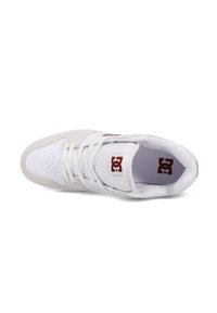 White sneaker with a beige suede toe cap, lace-up design, perforations on the toe, and a maroon logo on the side. Rubber sole visible.