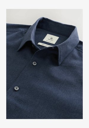 Sötét tengerészkék ing, 100% pamutból készült, galléros dekoltárral, két gombbal és normál szabással. Címke látható belül.