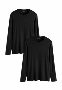 Magliette a manica lunga nere con scollo rotondo, tessuto morbido e vestibilità comoda, esposte impilate, senza motivi o dettagli visibili.