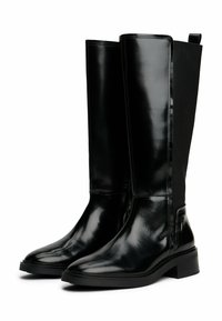 Pair of tall black leather boots with elastic side panels and low block heels, shown angled to the left on a white background.