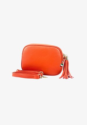 Small orange textured leather crossbody bag with detachable strap and tassel keychain featuring an Italian flag charm on white background.