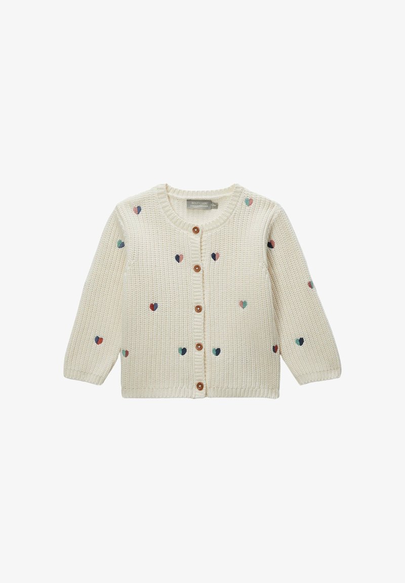 Cardigan crème en tricot avec manches longues, col rond et boutons en bois. Présente des motifs de cœurs colorés dispersés sur le tissu.
