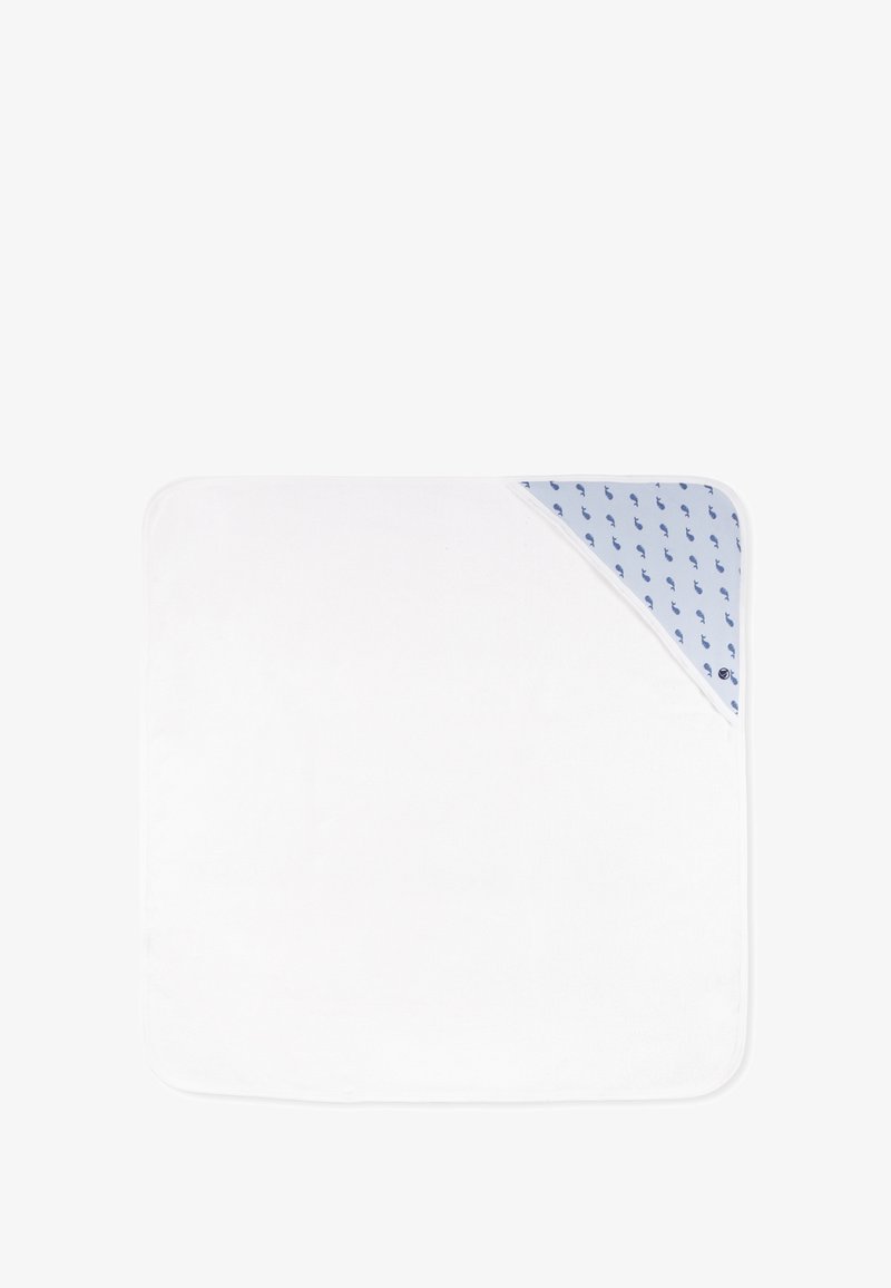 Couverture blanche avec un accent bleu présente un motif de baleine dans un coin. Matériau doux, forme carrée et bords arrondis.