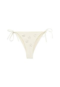 Bikini hlače v kremni barvi z nastavljivimi vezavami, okrašene s srebrnimi kroglicami, razporejenimi v različne vzorce spredaj. Gladka tekstura.