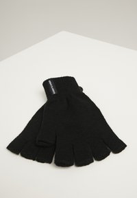 Black, knitted fingerless gloves with a ribbed cuff and logo tag. The design features open fingertips, enhancing dexterity and grip.