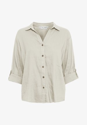 Light beige linen button-up shirt with a V-neck, roll-up sleeves, and six brown buttons down the front. Soft texture and relaxed fit.